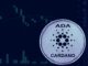 Picture of a Cardano coin in front of a candlestick chart